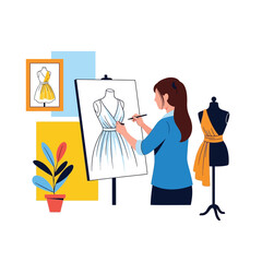 A woman designs a dress on a canvas, with a mannequin and framed sketch nearby.