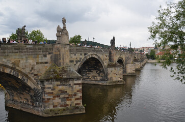 Iconic Charles Bridge in Prague, spanning the Vltava River with its historic statues and Gothic towers – a symbol of the city’s rich medieval heritage and architectural beauty