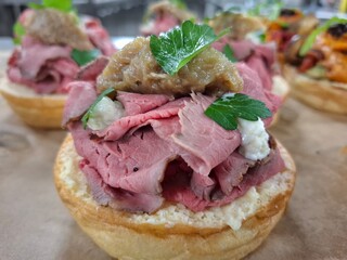 Succulent Roast Beef Tartlet Garnished with Parsley and Gourmet Topping