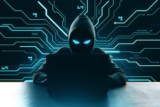 Hacker in hoodie using laptop with glowing eyes on dark digital circuit background, symbolizing cybercrime and online threats in technology world.