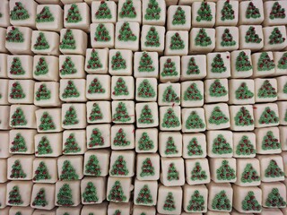 Rows of Festive Christmas Treats Decorated with Holiday-Themed Designs