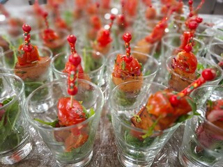 Elegant Glass Serving Cups with Colorful Toothpick Hors D'oeuvres at Event