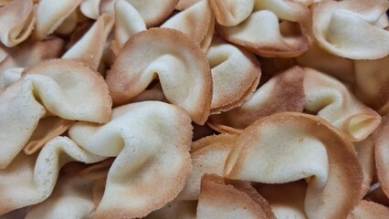 Close-Up of Golden Homemade Fortune Cookies in a Pile
