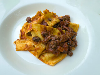 Delicious pappardelle with meat ragù pasta. Traditional Italian food