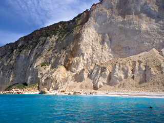 Fototapeta premium View of Mizithres Beach from the sea, Zakynthos Island, Greece. Ideal for Mediterranean travel, summer escape, or coastal nature-themed projects.