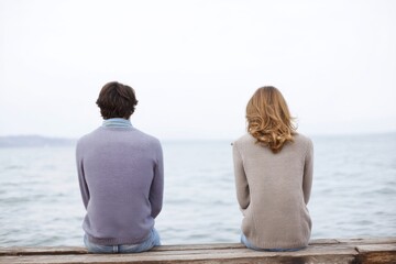 Fototapeta premium Identifying signs of struggles in a relationship while sitting by the water