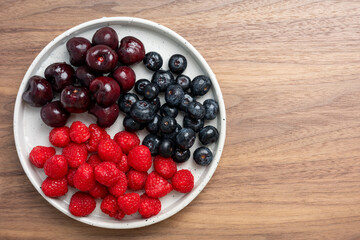 The High resolution fruit photo of mixed fruits including cherries, raspberries and blueberries...