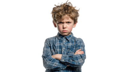 Young boy pouting with a serious expression, wearing a blue plaid shirt, isolated on white background.