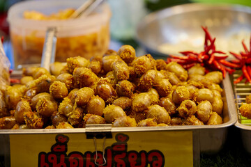 Fried I-san pork meat sausage at street food in Thailand
