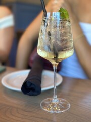 Refreshing cocktail served at a stylish restaurant during a sunny afternoon gathering with friends