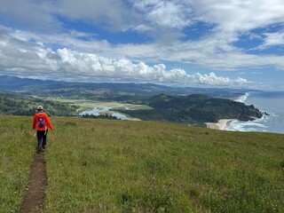 Hiking along the coastal trail with scenic views on a clear day in Northern California