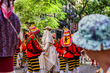 A man watches the Moma Dance during Corpus Christi celebrations in Valencia