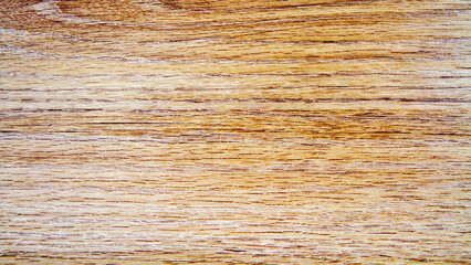 Seamless background of natural wood texture with brown grain pattern.