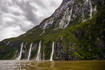 The Four Sisters Waterfalls Cascade from Dramatic Mountain Cliffs During Heavy Rainfall – Ferry...