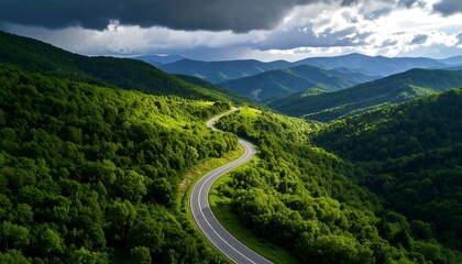 Winding road through lush green mountains