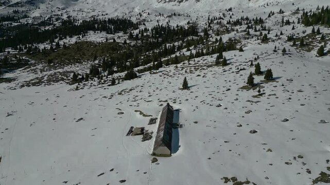 Spring snow on the Montasio plateau. Looking down on Montasio and Canin from above.