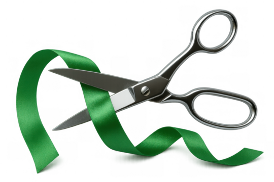 Sharp metallic scissors slicing vivid green ribbon against transparent backdrop, symbolizing ceremonial moments and milestone achievements