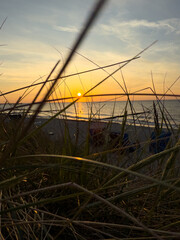 Tranquil waves roll onto the Baltic Sea shore under a wide open sky — a peaceful moment by the...