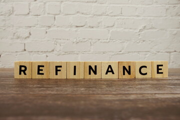Refinance word alphabet letters on wooden background