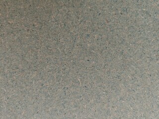 Textured Recycled Paper Surface with Subtle Blue and Beige Fibers