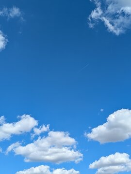 Blue sky with strong big white fluffy clouds