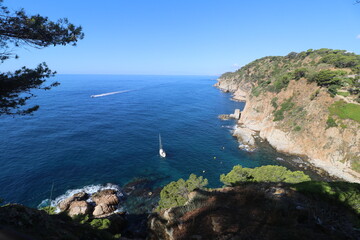 Rocks, stones and cliffs of the Codolar cove of Tossa de Mar in the south of the Costa Brava in...