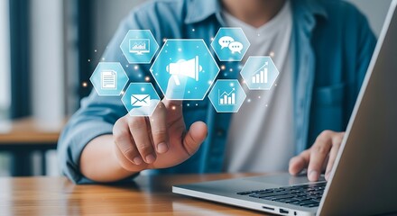 A focused hand clicks on a digital marketing hexagon glowing softly above a sleek laptop on a polished wooden desk