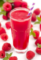 Raspberry juice, raspberry smoothie with drinking straw. Refreshing cold cocktail drink made from fresh fruit and mint in a glass cup. Isolated object.