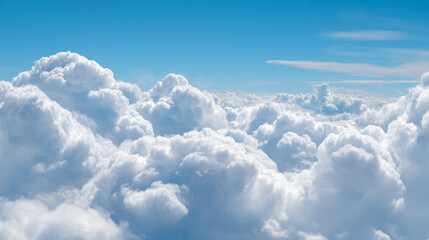 Naklejka premium Expansive view of voluminous cumulus clouds under a clear blue sky
