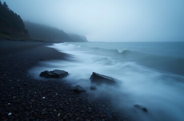 Obraz premium Misty Coastal Landscape Peaceful Sea Shoreline Stones Waves ai generated