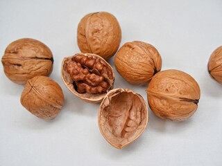 Ripe walnuts or Juglans or Kacang Kenari isolated on white background.