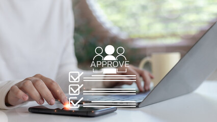 Businesswoman using smartphone and laptop for digital document approval with checklist and workflow icons. Online process and remote work concept.