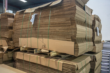 Stacks of Flat Corrugated paper boxes for shipping