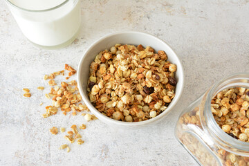 Granola in a bowl with milk, ready for breakfast flat lay