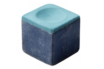 Blue billiard chalk cube displaying chalky wear, powdery surface crumbling, resting against transparent backdrop