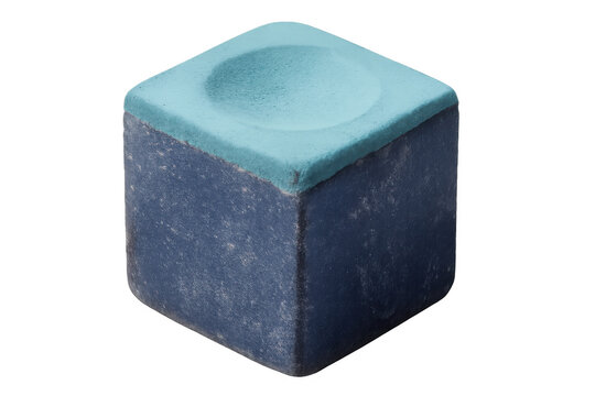 Blue billiard chalk cube displaying chalky wear, powdery surface crumbling, resting against transparent backdrop