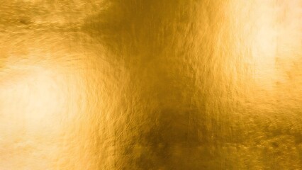 Naklejka premium Golden texture creates a shimmering, luxurious aesthetic with rich, warm, and inviting tones providing a glamorous backdrop.