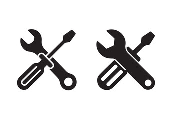 Two black silhouette icons of a wrench and screwdriver crossed isolated on white background