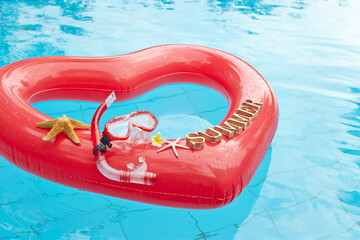 heart shaped float ,snorkeling, and summer items at the resort pool