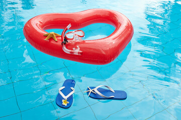 heart shaped float ,snorkeling, and summer items at the resort pool