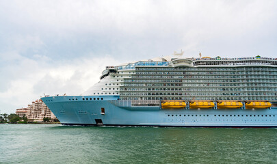 Cruise ship tour and travel at sea. Aerial view of luxury liner voyage. Ship leaving Miami beach...