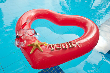 heart shaped float ,snorkeling, and summer items at the resort pool