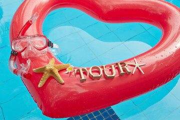 heart shaped float ,snorkeling, and summer items at the resort pool