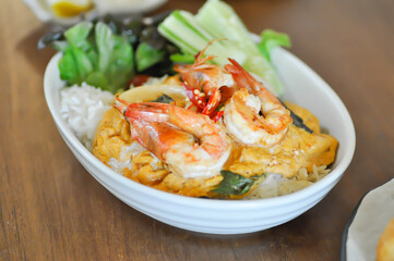 creamy omelet or omelet or omelette or fried egg with shrimp and squid or seafood omelette and rice