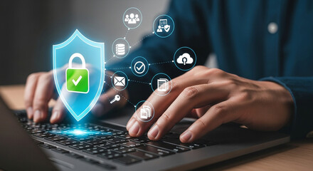 A person is typing on a laptop, ensuring cybersecurity and data protection with online security measures