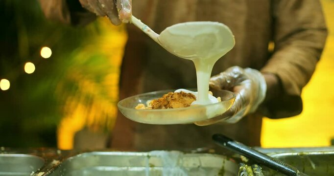 Indian caterers preparing delicious chat, panipuri, and patis at a festive event, showcasing vibrant flavors and traditional street food culture