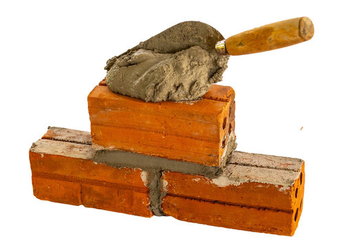 Bricklaying with Trowel and Mortar &ndash; Construction Work Close-Up and construction concept idea
