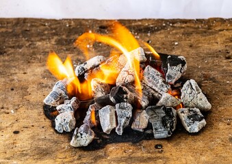 Glowing Charcoal Embers with Flames  and  Fire Heat Background for BBQ concept idea