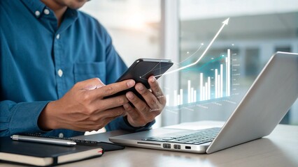 Business Professional Analyzing Data on Smartphone and Laptop Screen