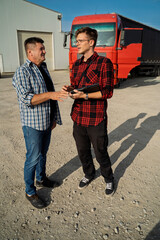 Trucker and fleet manger talking before the job 